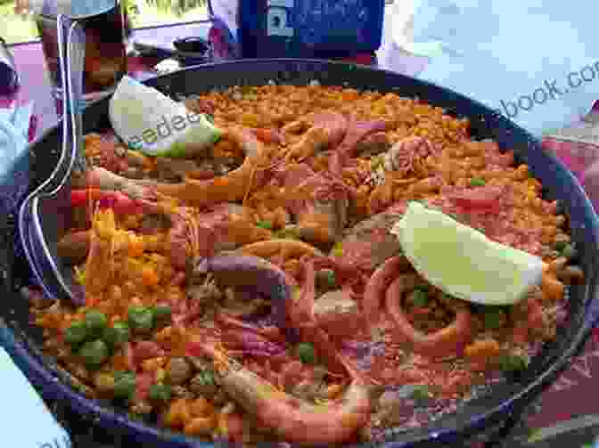 A Photo Of A Table Spread With Various Dishes From Sol Spain, Gibraltar, And Portugal, Including Paella, Tapas, Fish And Chips, Bacalhau, And Cataplana. Sol Spain Gibraltar Portugal